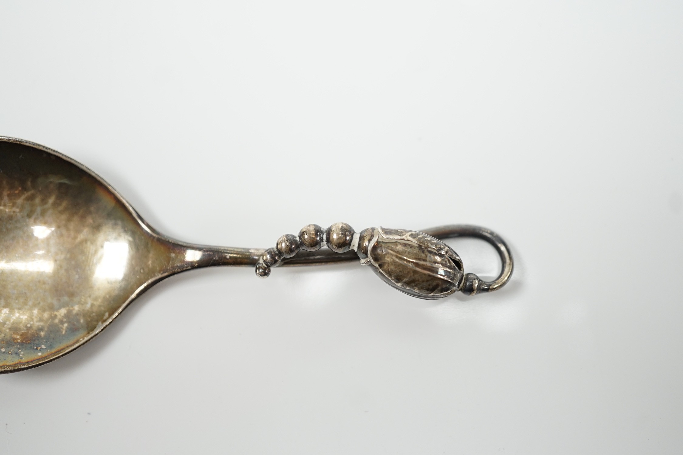 A George VI Georg Jensen silver blossom pattern caddy spoon, import marks for 1948, no.84, 10.2cm.